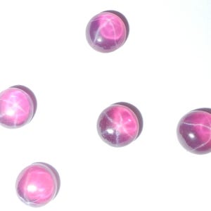 May include: Five pink star sapphires with a six-pointed star in the center of each stone.
