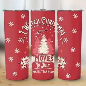 May include: Red stainless steel tumbler with a white design that says "I Watch Christmas Movies in July and All Year Round". The design also includes a Christmas tree, snowflakes, and a Santa Claus flying in a sleigh.