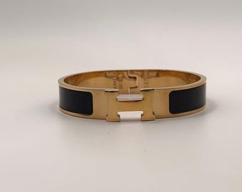 Bransoleta Hermès Clic H – czarna emalia, kolor złoty – 6 cm