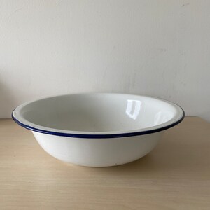 White antique enamel bowl with black rim, fruit bowl