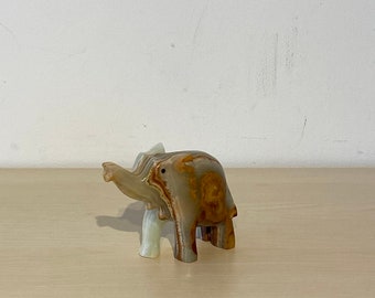 small cute elephant made of natural stone, marble, beige, green, decorative elephant