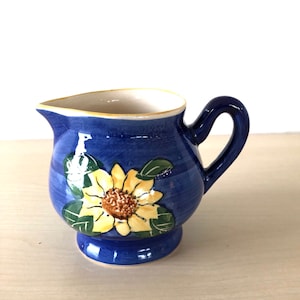 small blue ceramic jug, ceramic vase with sunflower, vintage jug