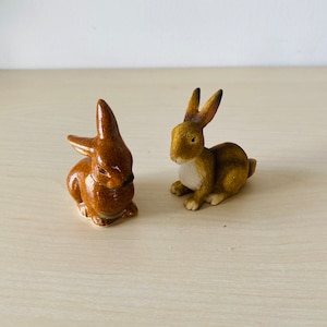 two small cute ceramic bunnies, ceramic bunnies