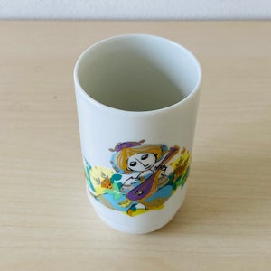 ROSENTHAL Germany studio-linie. Small porcelain vase &quot;Musician with Glockenspiel.&quot; Design: Bjoern Wiinblad. Height 10.5 cm. VINTAGE