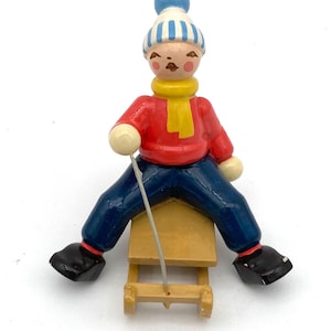 Wendt and Kuhn Wooden Boy in Red Sweater on a Sleigh Hand-Painted Christmas Figurine 5 cm