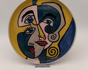 Talerz ceramiczny Ennio Simone, lata 90. XX w. – abstrakcyjna twarz w stylu Picassa – talerz ścienny, 27 cm