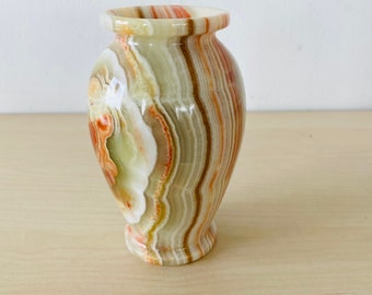 small cute marble vase or candlestick in the color beige