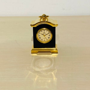 Meister Anker miniature clock with ring eyelet, blue-mottled metal, gold-plated, not tested