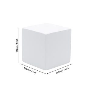 May include: A white, square-shaped ceramic block measuring 4 inches on each side. The block is a blank canvas for painting or decorating.