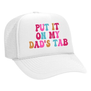 May include: White trucker hat with a colorful graphic that says "Put it on my dad's tab".