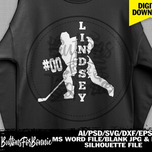 May include: A black and white silhouette of a hockey player with the name Lindsey spelled vertically down the centre of the player. The player is holding a hockey stick and the number 00 is on the player's jersey.