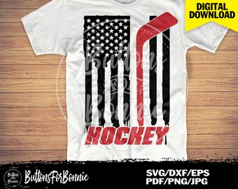 May include: A white t-shirt with a black and red distressed American flag design and a red hockey stick. The text "HOCKEY" is written in red below the flag.