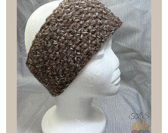 May include: A brown and white crocheted headband with a textured pattern. The headband is on a white mannequin head.