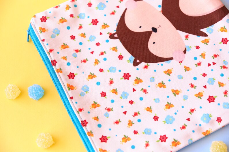 Cute squirrel pouch with flowers illustration