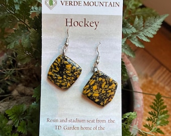 Repurposed Boston Bruins TD Garden seat suspended in epoxy resin earrings. Stainless steel no nickel hardware
