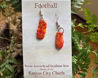Kansas City Chiefs Arrowhead stadium seat shredded and suspended in epoxy resin. NFL seat ads history to this football gift