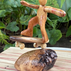Skateboarder Mini Sculpture on wood base made from figured Vermont Hardwood and pieces of sports equiptment