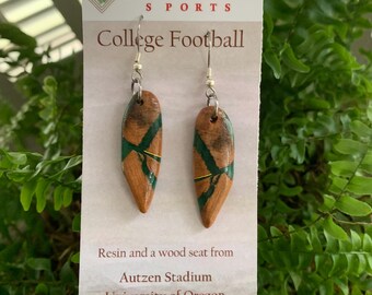 Repurposed University of Oregon Autzen Stadium seat in dark green epoxy resin. Football materials repurposed into memorabilia