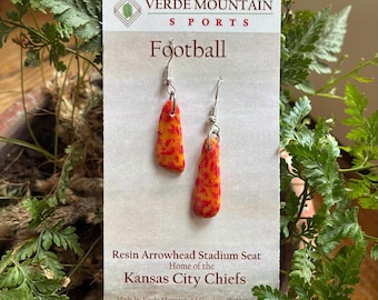 Kansas City Chiefs Arrowhead stadium seat shredded and suspended in epoxy resin. NFL seat ads history to this football gift