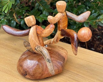 Soccer Kick Mini Sculpture on wood base made from figured Vermont Hardwood and pieces of sports equiptment