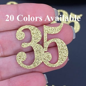 Può includere: Numero 35 in glitter dorato, 20 colori disponibili.