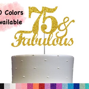 May include: Gold glitter cake topper with the numbers 75 and the word "Fabulous" in a cursive font. 20 colors available.