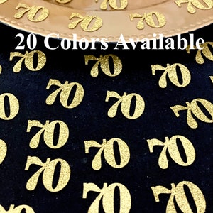 May include: Gold glitter confetti with the number 70 printed on each piece. The confetti is scattered on a black surface. The text "20 Colors Available" is visible in the image.