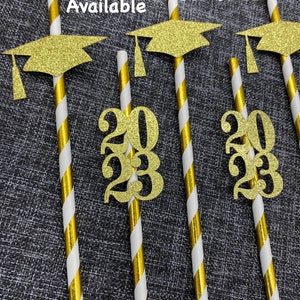 May include: Set of 12 gold graduation straws with a gold glitter graduation cap and the year 2023. All years are available.