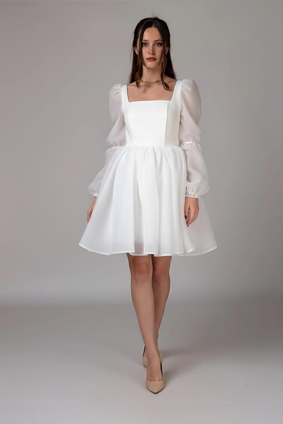 white dress with nude heels @elliatt #explorerpage #whitedress #blogger_at #allwhiteoutfit #influencer MODEL INFO Model is wearing size XS Height White Midi Dress - Styled