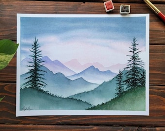 May include: Watercolor painting of a mountain landscape with two pine trees in the foreground. The mountains are painted in shades of blue, purple, and pink, with a soft, hazy effect. The sky is a light blue with a hint of pink.