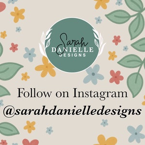 May include: A light green circle with the text "Sarah Danielle Designs" in white. The circle is surrounded by a floral pattern with pink, yellow, and blue flowers and green leaves. The text "Follow on Instagram @sarahdanielledesigns" is below the circle.