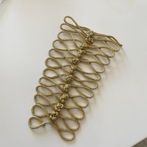 Gold knotted buckle for costume