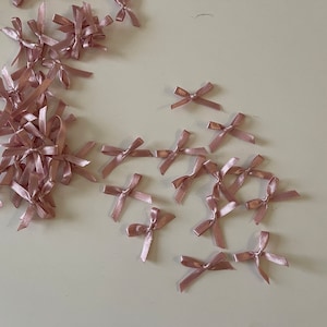 20 vecchi papillon color rosa
