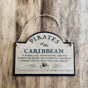 Pirates of the Caribbean We Want The RedHead Disneyland WDW Caribbean Plaza Disney World Attraction Ride Home Decor Sign Fish Extender Idea