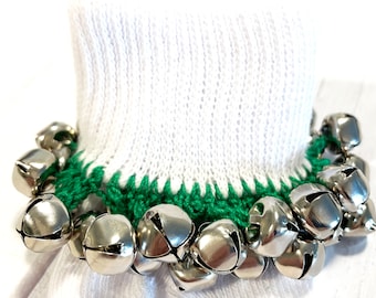 May include: White ankle socks with a green crocheted trim and silver jingle bells attached.