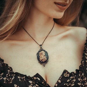 Pendant La Catrina sugar skull with roses ivory on black as a necklace for gothic outfit and fantasy cosplay