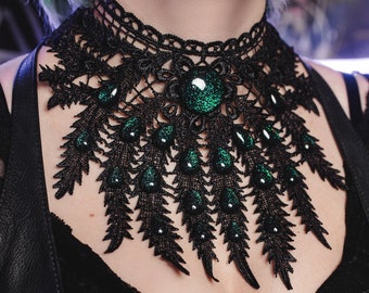 Black peacock necklace made of lace with colored glass stones as jewelry for gothic outfits and fantasy cosplay photo shoots