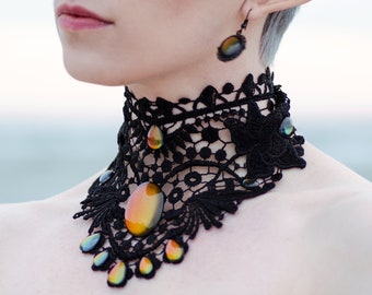 Black wing necklace made of lace with colored cabochon glass stones for Gothic weddings and as jewelry for photo shoots