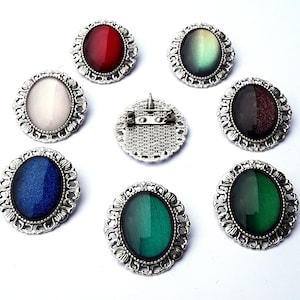 Oval brooch in your choice of color made of glass stones in black, silver and bronze as cosplay jewelry and gothic gift