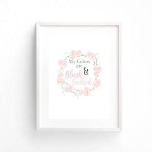 May include: A framed print with a white border. The artwork features a floral wreath in shades of pink and green, surrounding the text "My Colors are Blush & Bashful" in pink and green script.