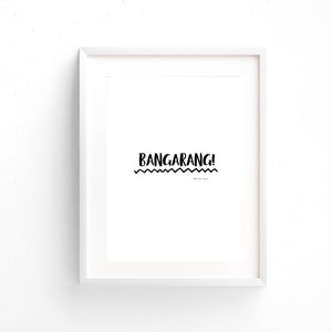 May include: A white framed print with the text "BANGARANG!" in black, with a wavy line underneath and the text "The last house" in smaller font.