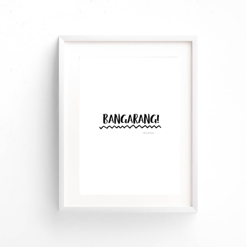 May include: A white framed print with the text "BANGARANG!" in black, with a wavy line underneath and the text "The last house" in smaller font.
