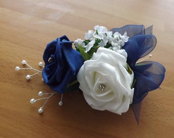 White & navy foam rose corsage with gypsophillia,diamante,pearls and a navy organza bow