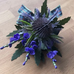 1 x Purple Scottish thistle and purple heather button holes with flower of Scotland tartan ribbon