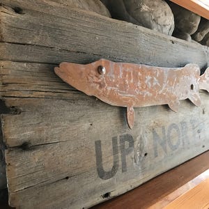 Up north fishing sign. Rusty Metal Northern pike mounted on weather wood. GPS engraved coordinates for your cabin or man cave