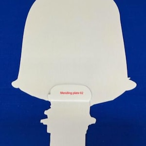 May include: White scooter-shaped cutout with handlebars and the text "Mending plate 01" and "Mending plate 02" on a blue background. The scooter design is simple and stylized.