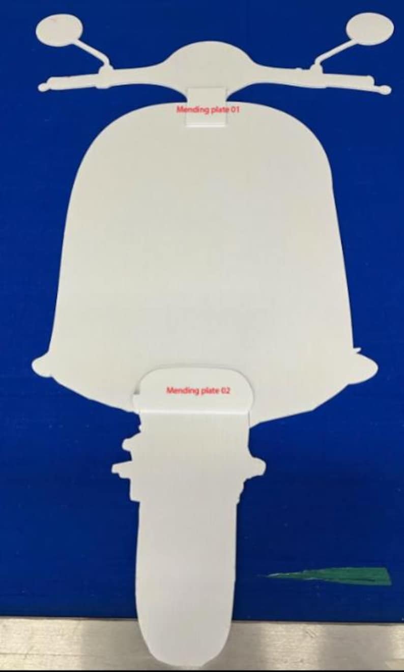 May include: White scooter-shaped cutout with handlebars and the text "Mending plate 01" and "Mending plate 02" on a blue background. The scooter design is simple and stylized.