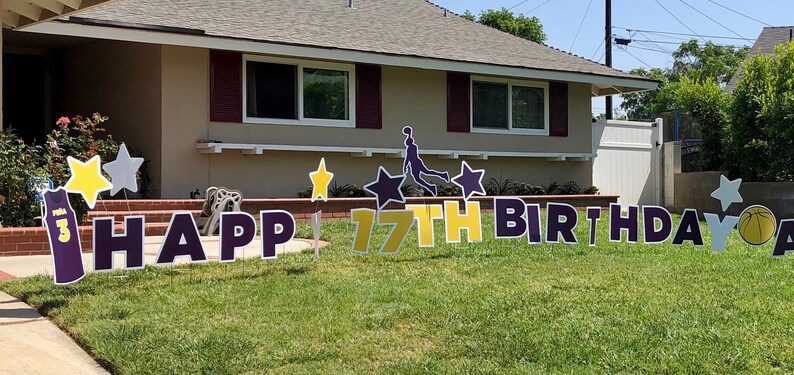 May include: Happy 17th Birthday yard sign with a basketball theme. The sign features a basketball player silhouette, a basketball, stars, and the words "Happy 17th Birthday".