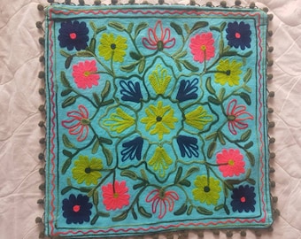 Embroidered cushion cover. Pom Pom Edging . Hand made Suzani Embroidery