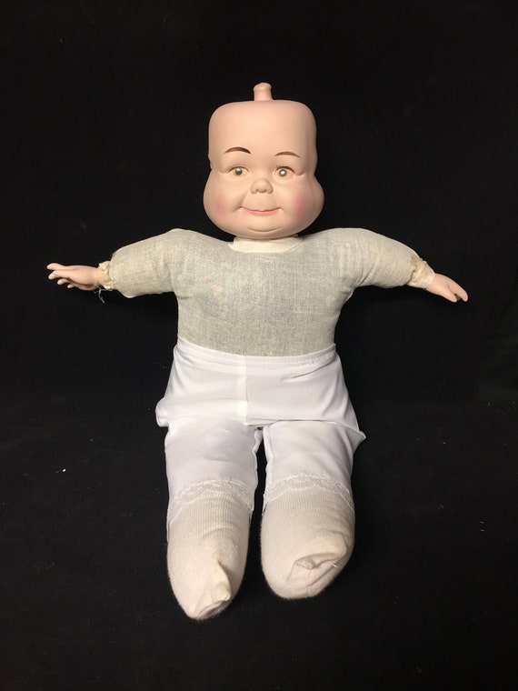 3 faced porcelain doll